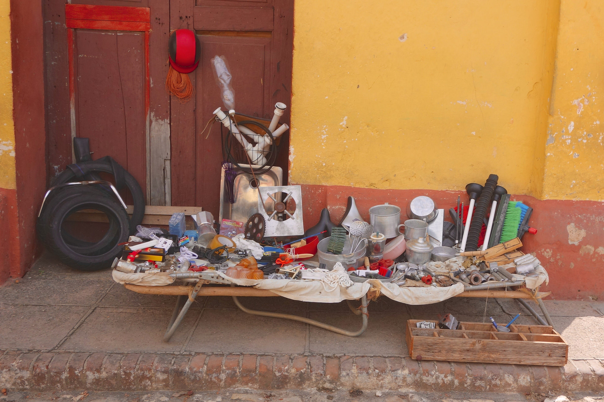 Plastic and metal parts sold on the street in Trinidad.